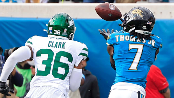 Jacksonville Jaguars wide receiver Brian Thomas Jr. (7) hauls in a touchdown score against New York Jets safety Chuck Clark (36) before an NFL football matchup Sunday, Dec. 15, 2024 at EverBank Stadium in Jacksonville, Fla. [Corey Perrine/Florida Times-Union]