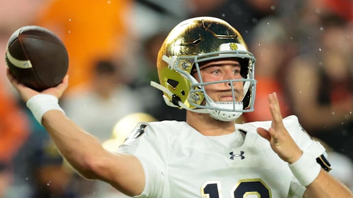 Aug 31, 2025; Miami Gardens, Florida, USA; Notre Dame Fighting Irish quarterback CJ Carr (13) drops back to pass against the Miami Hurricanes during the first quarter at Hard Rock Stadium. Aug 31, 2025; Miami Gardens, Florida, USA; Notre Dame Fighting Irish quarterback CJ Carr (13) drops back to pass against the Miami Hurricanes during the first quarter at Hard Rock Stadium.