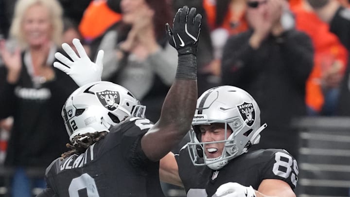 Dec 7, 2025; Paradise, Nevada, USA;  Las Vegas Raiders tight end Brock Bowers (89) reacts with running back Ashton Jeanty (2) after catching a touchdown against the Denver Broncos during the first half at Allegiant Stadium. Mandatory Credit: Kirby Lee-Imagn Images