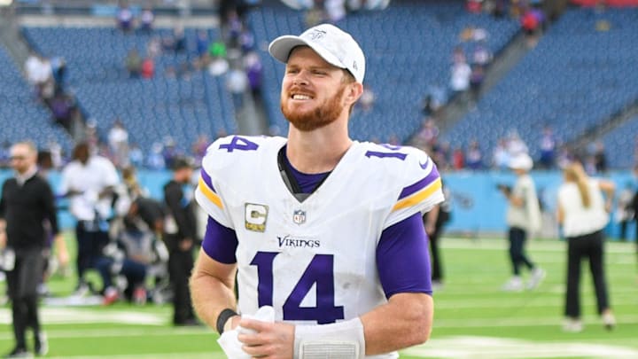 Nov 17, 2024; Nashville, Tennessee, USA; Minnesota Vikings quarterback Sam Darnold (14) smiles as he leaves the field against the Tennessee Titans during the second half at Nissan Stadium. Mandatory Credit: Steve Roberts-Imagn Images