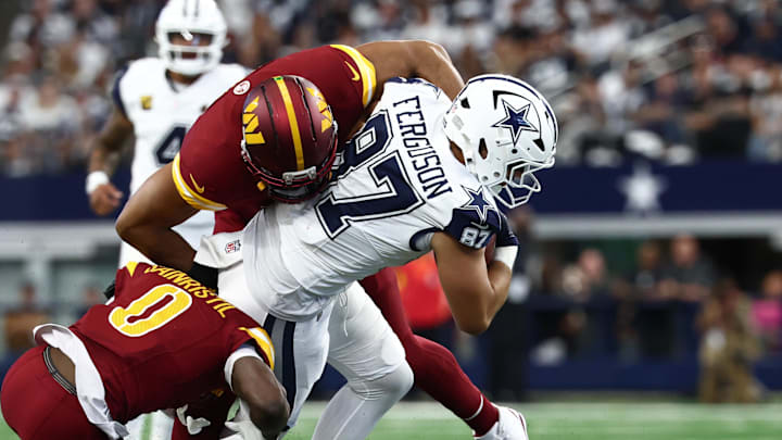 Dallas Cowboys tight end Jake Ferguson drags Washington Commanders defenders at AT&T Stadium Dallas Cowboys tight end Jake Ferguson drags Washington Commanders defenders at AT&T Stadium