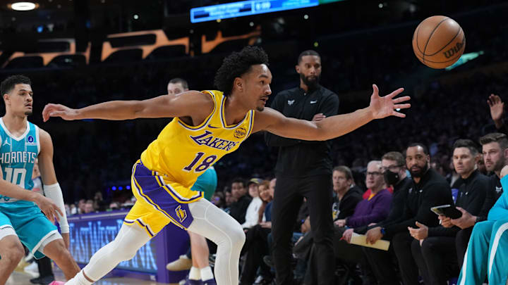 Jan 15, 2026; Los Angeles, California, USA; Los Angeles Lakers guard Kobe Bufkin (18_ pursues the ball against the Charlotte Hornets in the first half at Crypto.com Arena. Mandatory Credit: Kirby Lee-Imagn Images