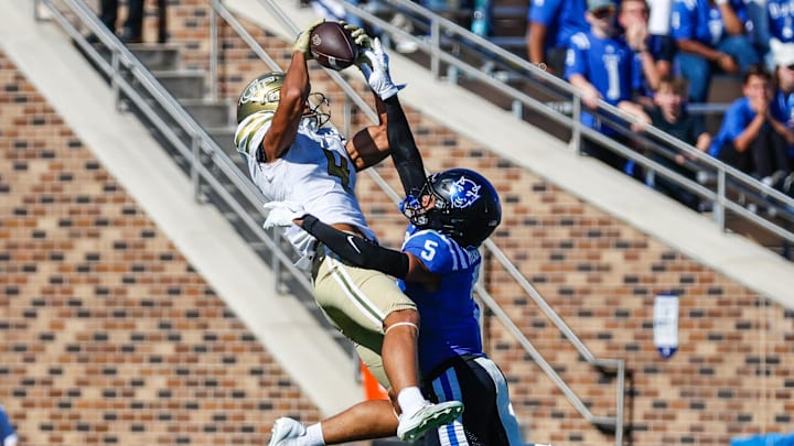 Oct 18, 2025; Durham, North Carolina, USA; Georgia Tech Yellow Jackets wide receiver Isiah Canion (4) catches the pass past Duke Blue Devils cornerback Kimari Robinson (5) during the second half of the game at Wallace Wade Stadium. Mandatory Credit: Jaylynn Nash-Imagn Images Oct 18, 2025; Durham, North Carolina, USA; Georgia Tech Yellow Jackets wide receiver Isiah Canion (4) catches the pass past Duke Blue Devils cornerback Kimari Robinson (5) during the second half of the game at Wallace Wade Stadium. Mandatory Credit: Jaylynn Nash-Imagn Images
