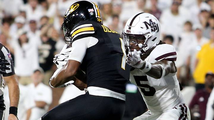 Missouri Tigers wide receiver Donovan Olugbode (1) catches a pass for a touchdown as Mississippi State Bulldogs safety Jardin Gilbert (5) defends during the second quarter at Davis Wade Stadium at Scott Field.
