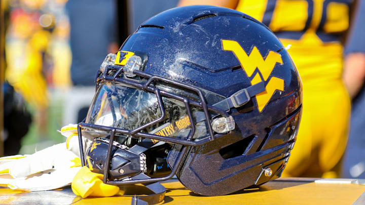 Aug 30, 2025; Morgantown, West Virginia, USA; A West Virginia Mountaineers football helmet is seen along the sidelines during the fourth quarter against the Robert Morris Colonials at Milan Puskar Stadium. Mandatory Credit: Ben Queen-Imagn Images