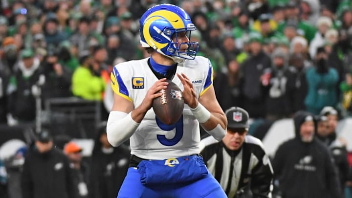 Jan 19, 2025; Philadelphia, Pennsylvania, USA; Los Angeles Rams quarterback Matthew Stafford (9) looks for a receiver against the Philadelphia Eagles in a 2025 NFC divisional round game at Lincoln Financial Field. Mandatory Credit: Eric Hartline-Imagn Images