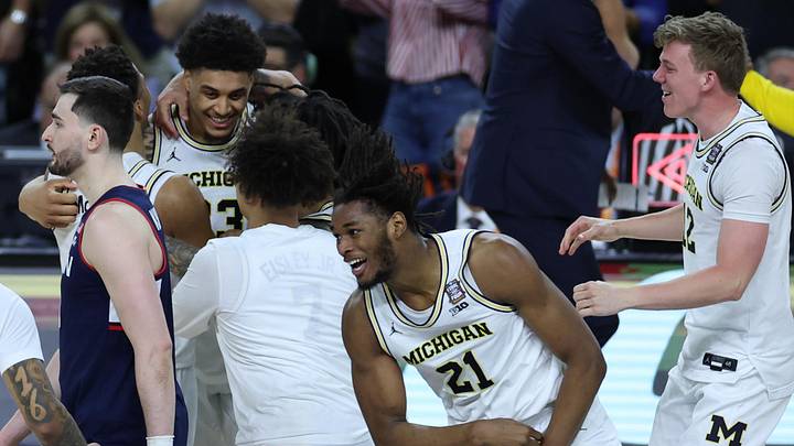 Apr 6, 2026; Indianapolis, IN, USA; Michigan Wolverines forward Morez Johnson Jr. (21) celebrates after defeating the UConn Huskies in the national championship of the Final Four of the men's 2026 NCAA Tournament at Lucas Oil Stadium. Mandatory Credit: Trevor Ruszkowski-Imagn Images Apr 6, 2026; Indianapolis, IN, USA; Michigan Wolverines forward Morez Johnson Jr. (21) celebrates after defeating the UConn Huskies in the national championship of the Final Four of the men's 2026 NCAA Tournament at Lucas Oil Stadium. Mandatory Credit: Trevor Ruszkowski-Imagn Images