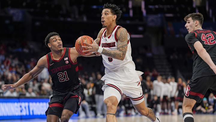 Mar 13, 2025; Charlotte, NC, USA; Louisville Cardinals guard Terrence Edwards Jr. (5) drives to the basket against Stanford Cardinal guard Jaylen Blakes (21) during the second half at Spectrum Center. Mandatory Credit: Jim Dedmon-Imagn Images Mar 13, 2025; Charlotte, NC, USA; Louisville Cardinals guard Terrence Edwards Jr. (5) drives to the basket against Stanford Cardinal guard Jaylen Blakes (21) during the second half at Spectrum Center. Mandatory Credit: Jim Dedmon-Imagn Images