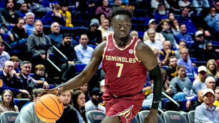 Dec 3, 2024; Baton Rouge, Louisiana, USA;  Florida State Seminoles forward Jerry Deng (7) brings the ball up court against the LSU Tigers during the second half at Pete Maravich Assembly Center. Mandatory Credit: Stephen Lew-Imagn Images