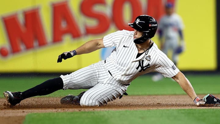 Oct 28, 2024; New York, New York, USA; New York Yankees designated hitter Giancarlo Stanton (27) slides into second with a double during the fourth inning against the Los Angeles Dodgers in game three of the 2024 MLB World Series at Yankee Stadium. Oct 28, 2024; New York, New York, USA; New York Yankees designated hitter Giancarlo Stanton (27) slides into second with a double during the fourth inning against the Los Angeles Dodgers in game three of the 2024 MLB World Series at Yankee Stadium.