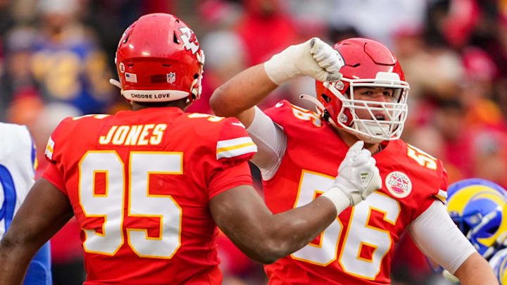 Nov 27, 2022; Kansas City, Missouri, USA; Kansas City Chiefs defensive end George Karlaftis (56) celebrates with defensive tackle Chris Jones (95) after a sack against the Los Angeles Rams during the first half at GEHA Field at Arrowhead Stadium. Mandatory Credit: Jay Biggerstaff-Imagn Images