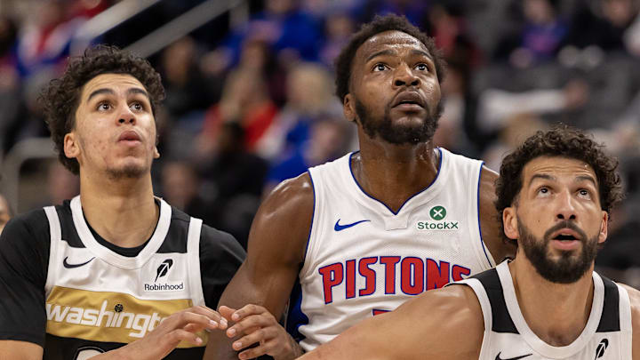 Feb 5, 2026; Detroit, Michigan, USA; Detroit Pistons forward Paul Reed (7) battles for position between Washington Wizards guard Will Riley (27) and forward Anthony Gill (16) during the second half at Little Caesars Arena. Mandatory Credit: David Reginek-Imagn Images