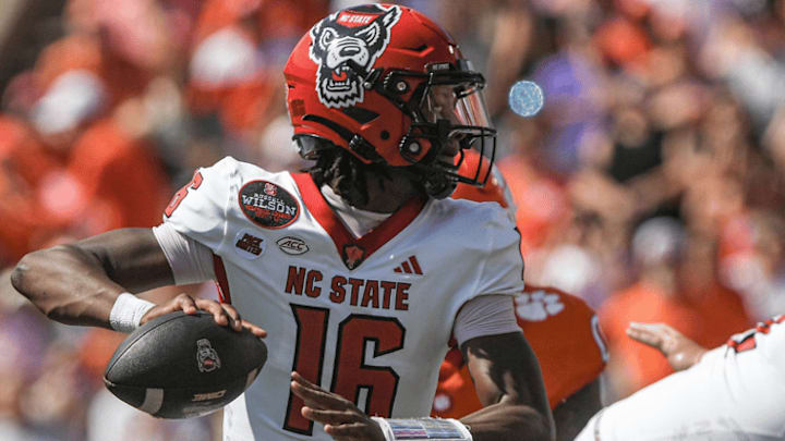 Sep 21, 2024; Clemson, South Carolina, USA; North Carolina State Wolfpack quarterback CJ Bailey (16) throws against Clemson Tigers during the first quarter at Memorial Stadium.