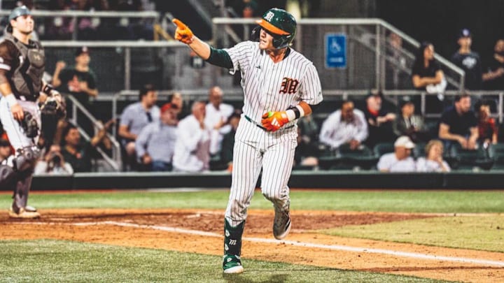 Miami catcher Alex Sosa smashing a home run against Lehigh during opening weekend
