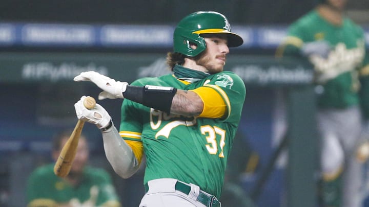 Sep 14, 2020; Seattle, Washington, USA; Oakland Athletics catcher Jonah Heim (37) hits an RBI-single against the Seattle Mariners during the third inning at T-Mobile Park. Mandatory Credit: Joe Nicholson-Imagn Images