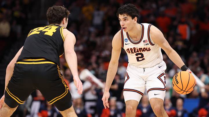 Mar 28, 2026; Houston, TX, USA; Illinois Fighting Illini guard Andrej Stojakovic (2) controls the ball against Iowa Hawkeyes guard Tate Sage (24) in the first half during an Elite Eight game of the South Regional of the men's 2026 NCAA Tournament at Toyota Center. Mandatory Credit: Troy Taormina-Imagn Images