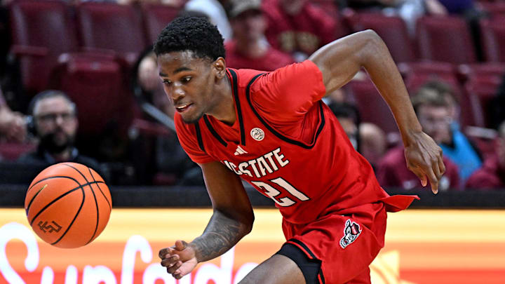 Jan 10, 2026; Tallahassee, Florida, USA; Florida State Seminoles guard Cam Miles (2) loses the ball as North Carolina State Wolfpack guard Terrance Arceneaux (21) picks it up during the second half at Donald L. Tucker Center. Mandatory Credit: Melina Myers-Imagn Images