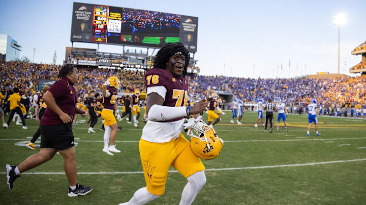 Nov 23, 2024; Tempe, Arizona, USA; Arizona State Sun Devils offensive lineman Champ Westbrooks (76) celebrates after defeating the Brigham Young Cougars at Mountain America Stadium. Mandatory Credit: Mark J. Rebilas-Imagn Images
