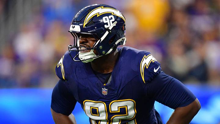 Oct 23, 2025; Inglewood, California, USA; Los Angeles Chargers defensive tackle Justin Eboigbe (92) reacts after a tackle against the Minnesota Vikings during the first half at SoFi Stadium. Mandatory Credit: Gary A. Vasquez-Imagn Images