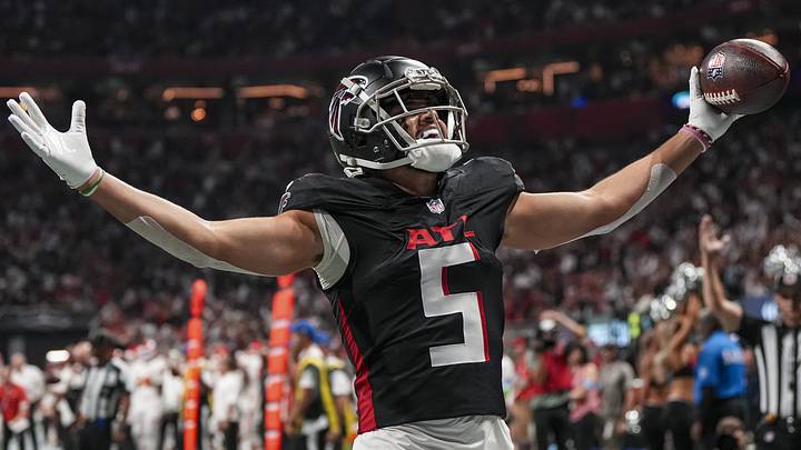 Sep 22, 2024; Atlanta, Georgia, USA; Atlanta Falcons wide receiver Drake London (5) reacts after catching a touchdown pass against the Kansas City Chiefs during the first quarter at Mercedes-Benz Stadium. Mandatory Credit: Dale Zanine-Imagn Images