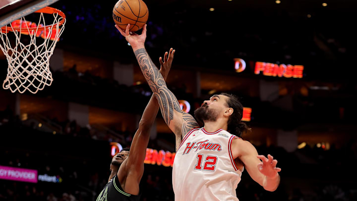 Jan 18, 2026; Houston, Texas, USA; Houston Rockets center Steven Adams (12) rebounds against the New Orleans Pelicans during the third quarter at Toyota Center. Mandatory Credit: Erik Williams-Imagn Images