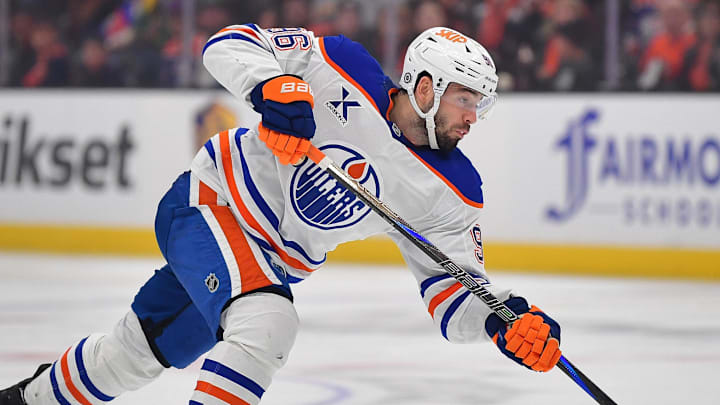Apr 7, 2025; Anaheim, California, USA; Edmonton Oilers defenseman Jake Walman (96) shoots against the Anaheim Ducks during the third period at Honda Center. Mandatory Credit: Gary A. Vasquez-Imagn Images
