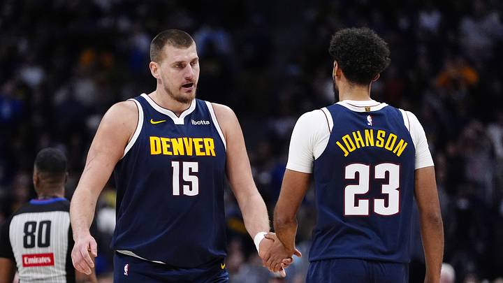 Dec 15, 2025; Denver, Colorado, USA; Denver Nuggets forward Cameron Johnson (23) and center Nikola Jokic (15) in the second quarter against the Houston Rockets at Ball Arena. Dec 15, 2025; Denver, Colorado, USA; Denver Nuggets forward Cameron Johnson (23) and center Nikola Jokic (15) in the second quarter against the Houston Rockets at Ball Arena.