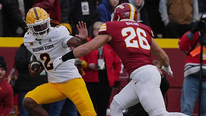 Arizona State Sun Devils quarterback Jeff Sims (2) battle for a few yards as Iowa State Cyclones' linebacker Caleb Bacon (26)