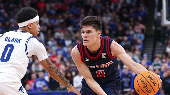 Mar 6, 2026; Newark, New Jersey, USA; St. John's basketball guard Dylan Darling (0) is guarded by Seton Hall Pirates guard Adam Clark (0) during the first half at Prudential Center.