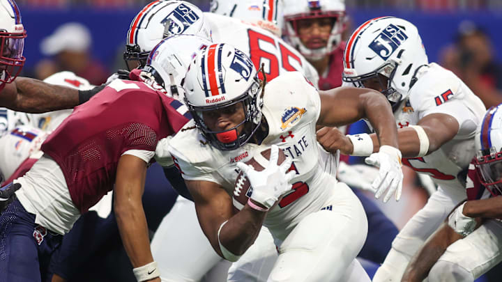 Dec 14, 2024; Atlanta, GA, USA; Jackson State Tigers running back Irv Mulligan (5) runs for a touchdown against the South Carolina State Bulldogs in the fourth quarter at Mercedes-Benz Stadium. Mandatory Credit: Brett Davis-Imagn Images
Dec 14, 2024; Atlanta, GA, USA; Jackson State Tigers running back Irv Mulligan (5) runs for a touchdown against the South Carolina State Bulldogs in the fourth quarter at Mercedes-Benz Stadium. Mandatory Credit: Brett Davis-Imagn Images