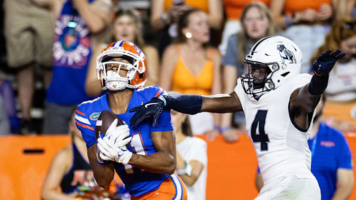 Sep 7, 2024; Gainesville, Florida, USA; Florida Gators wide receiver Aidan Mizell (11) makes a catch over Samford Bulldogs cornerback Xavier Lanier (4) during the second half at Ben Hill Griffin Stadium. Mandatory Credit: Matt Pendleton-Imagn Images