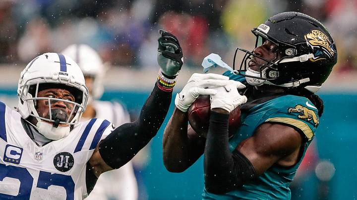 Dec 7, 2025; Jacksonville, Florida, USA;Jacksonville Jaguars wide receiver Brian Thomas Jr. (7) catches a pass over Indianapolis Colts cornerback Kenny Moore II (23) at EverBank Stadium. 