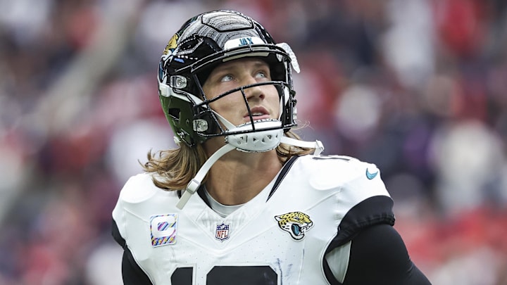Sep 29, 2024; Houston, Texas, USA; Jacksonville Jaguars quarterback Trevor Lawrence (16) jogs off the field after a play during the fourth quarter against the Houston Texans at NRG Stadium. Mandatory Credit: Troy Taormina-Imagn Images