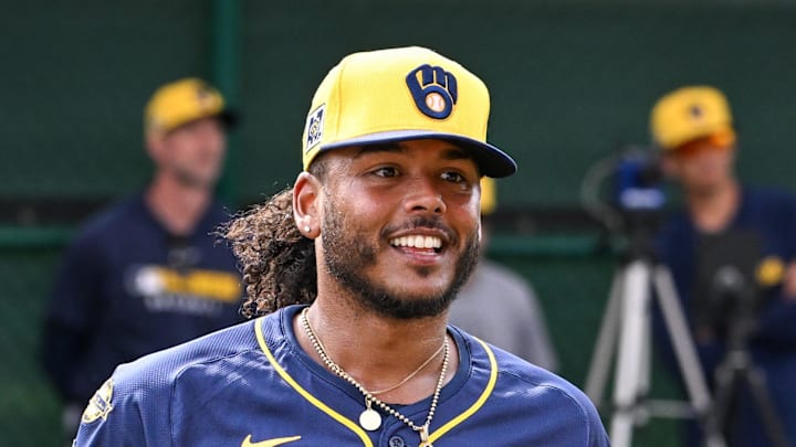 Freddy Peralta talks with a catcher.