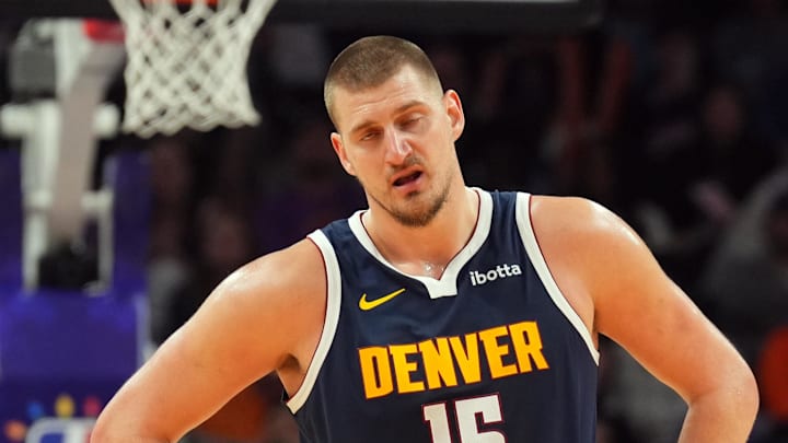 Dec 25, 2024; Phoenix, Arizona, USA; Denver Nuggets center Nikola Jokic (15) reacts against the Phoenix Suns during the second half at Footprint Center.