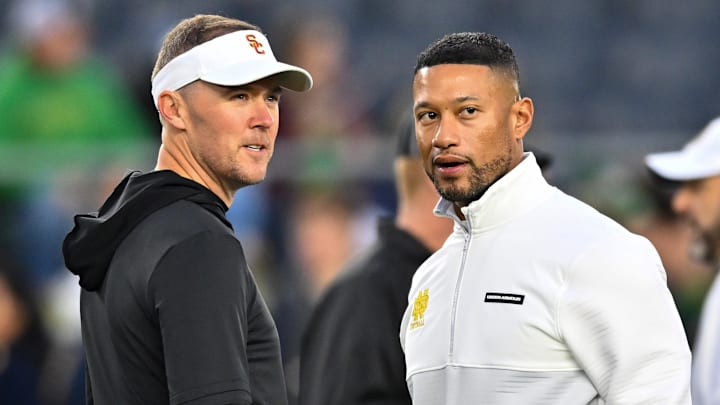Oct 14, 2023; South Bend, Indiana, USA; USC Trojans head coach Lincoln Riley and Notre Dame Fighting Irish head coach Marcus Freeman chat before the game at Notre Dame Stadium. Oct 14, 2023; South Bend, Indiana, USA; USC Trojans head coach Lincoln Riley and Notre Dame Fighting Irish head coach Marcus Freeman chat before the game at Notre Dame Stadium.