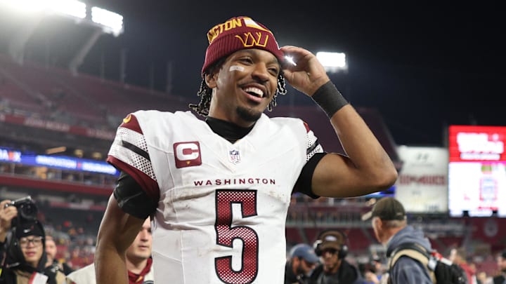 Jan 12, 2025; Tampa, Florida, USA; Washington Commanders quarterback Jayden Daniels (5) celebrates after winning a NFC wild card playoff against the Tampa Bay Buccaneers at Raymond James Stadium. Mandatory Credit: Nathan Ray Seebeck-Imagn Images
