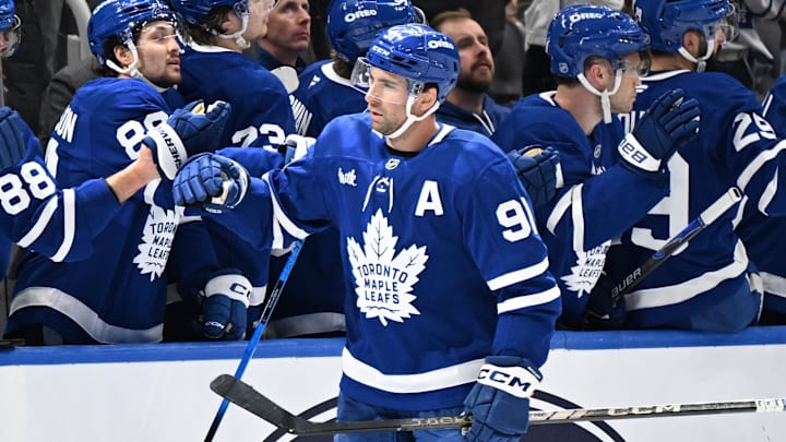 Mar 20, 2026; Toronto, Ontario, CAN;  Toronto Maple Leafs forward John Tavares (91) celebrates with team mates at the bench after scoring a goal against the Carolina Hurricanes in the second period at Scotiabank Arena. Mandatory Credit: Dan Hamilton-Imagn Images