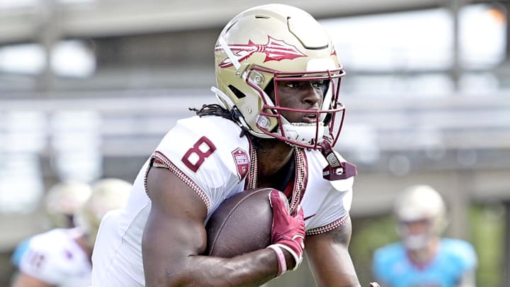 Apr 20, 2024; Tallahassee, Florida, USA; Florida State Seminoles wide receiver Hykeem Williams (8) runs the ball during the Spring Showcase at Doak S. Campbell Stadium. Mandatory Credit: Melina Myers-Imagn Images