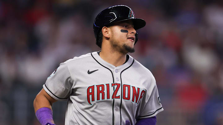 Jun 3, 2025; Atlanta, Georgia, USA; Arizona Diamondbacks catcher Gabriel Moreno (14) hits a single against the Atlanta Braves in the ninth inning at Truist Park. Mandatory Credit: Brett Davis-Imagn Images Jun 3, 2025; Atlanta, Georgia, USA; Arizona Diamondbacks catcher Gabriel Moreno (14) hits a single against the Atlanta Braves in the ninth inning at Truist Park. Mandatory Credit: Brett Davis-Imagn Images