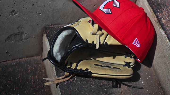 Apr 11, 2026; Cincinnati, Ohio, USA;  A view of an official Cincinnati Reds hat on the dugout steps during the game against the Los Angeles Angels at Great American Ball Park. Mandatory Credit: Aaron Doster-Imagn Images