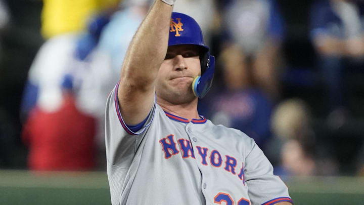New York Mets first base Pete Alonso (20) gestures after hitting a double against the Chicago Cubs New York Mets first base Pete Alonso (20) gestures after hitting a double against the Chicago Cubs