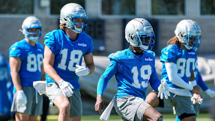 Detroit Lions wide receivers Dominic Lovett (19) and Isaac TeSlaa (18) practice during rookie minicamp 