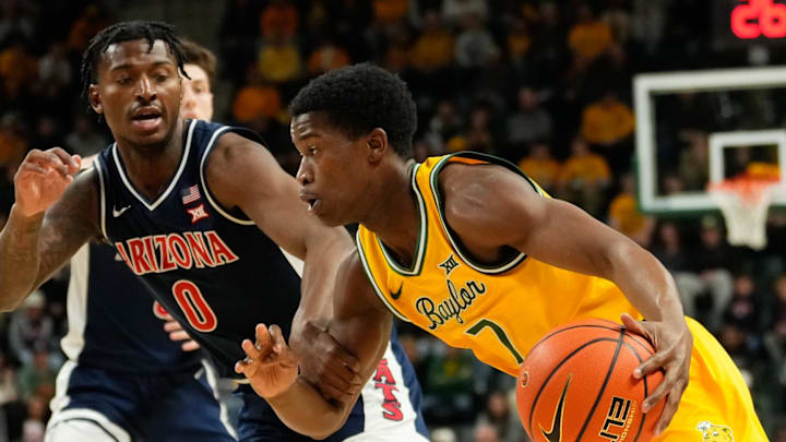 Feb 17, 2025; Waco, Texas, USA;  Baylor Bears guard VJ Edgecombe (7) drives to the basket against Arizona Wildcats guard Jaden Bradley (0) during the first half at Paul and Alejandra Foster Pavilion. Mandatory Credit: Chris Jones-Imagn Images