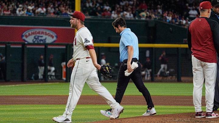 Jun 1, 2025; Phoenix, Arizona, USA; Arizona Diamondbacks starting pitcher Corbin Burnes (39) reacts after an injury in the fith inning and leaves the field against the Washington Nationals at Chase Field. 