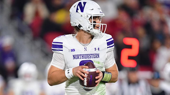 Northwestern Wildcats quarterback Preston Stone drops back to pass against the USC Trojans.