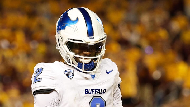 Aug 28, 2025; Minneapolis, Minnesota, USA; Buffalo Bulls quarterback Ta'Quan Roberson (2) celebrates wide receiver Victor Snow's (0) touchdown catch against the Minnesota Golden Gophers during the second half of the game at Huntington Bank Stadium. Mandatory Credit: Matt Krohn-Imagn Images