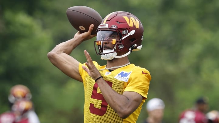 Jun 5, 2024; Ashburn, VA, USA; Washington Commanders quarterback Jayden Daniels (5) passes a ball during an OTA workout at Commanders Park. Mandatory Credit: Geoff Burke-USA TODAY Sports Jun 5, 2024; Ashburn, VA, USA; Washington Commanders quarterback Jayden Daniels (5) passes a ball during an OTA workout at Commanders Park. Mandatory Credit: Geoff Burke-USA TODAY Sports