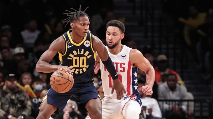 Oct 29, 2022; Brooklyn, New York, USA;  Indiana Pacers guard Bennedict Mathurin (00) controls the ball against Brooklyn Nets guard Ben Simmons (10) in the fourth quarter at Barclays Center. Mandatory Credit: Wendell Cruz-USA TODAY Sports