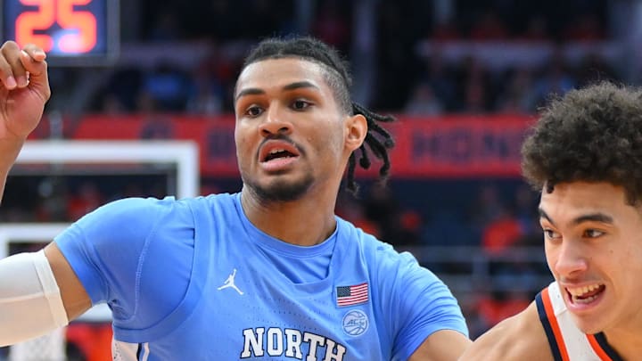 Feb 21, 2026; Syracuse, New York, USA; Syracuse Orange guard Naithan George (11) drives against North Carolina Tar Heels forward Jarin Stevenson (15) during the second half at the JMA Wireless Dome. Mandatory Credit: Rich Barnes-Imagn Images Feb 21, 2026; Syracuse, New York, USA; Syracuse Orange guard Naithan George (11) drives against North Carolina Tar Heels forward Jarin Stevenson (15) during the second half at the JMA Wireless Dome. Mandatory Credit: Rich Barnes-Imagn Images